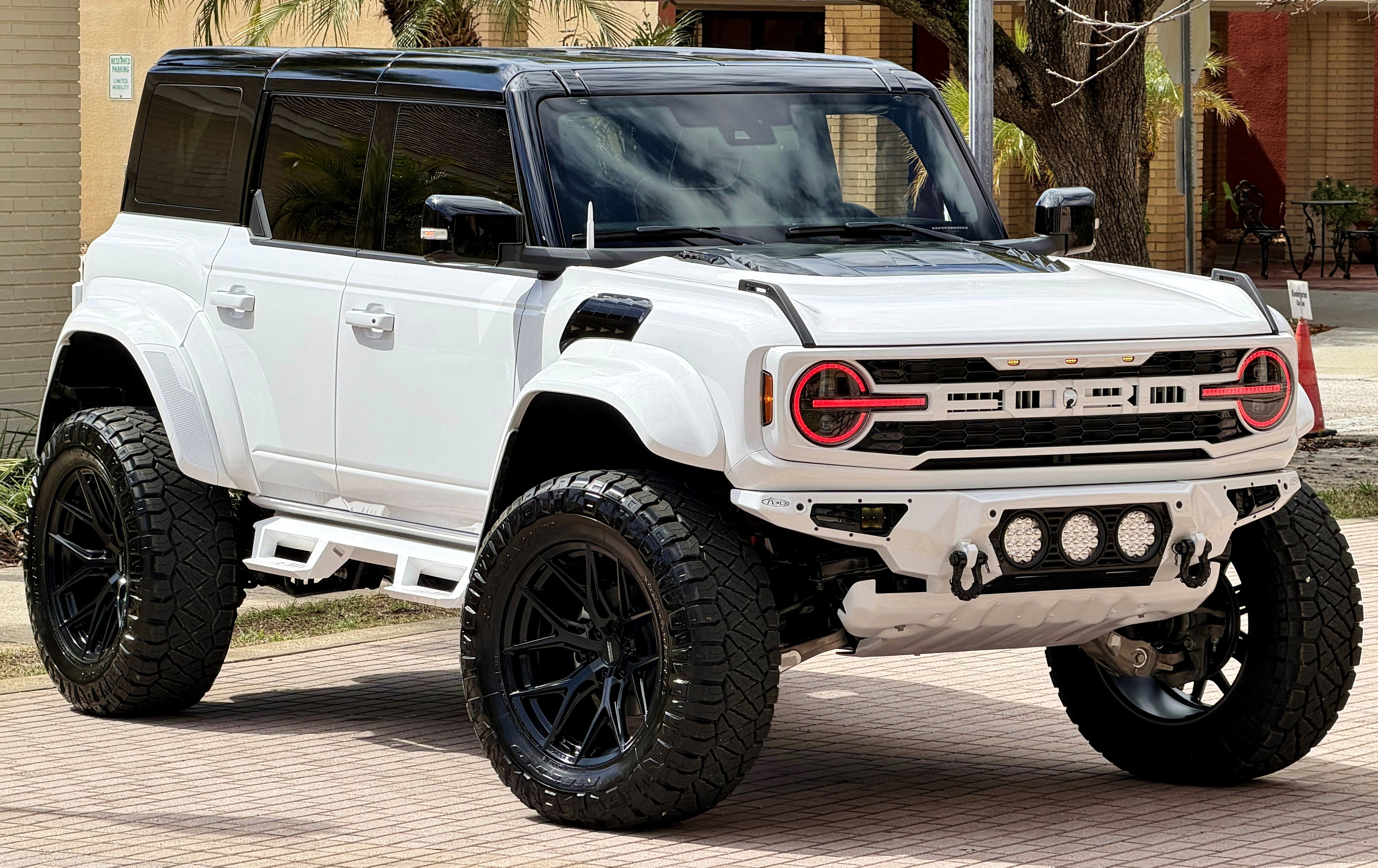 2026 Ford Bronco Raptor Black Appearance Luxury Package Custom Lifted in Oxford White — front three-quarter view