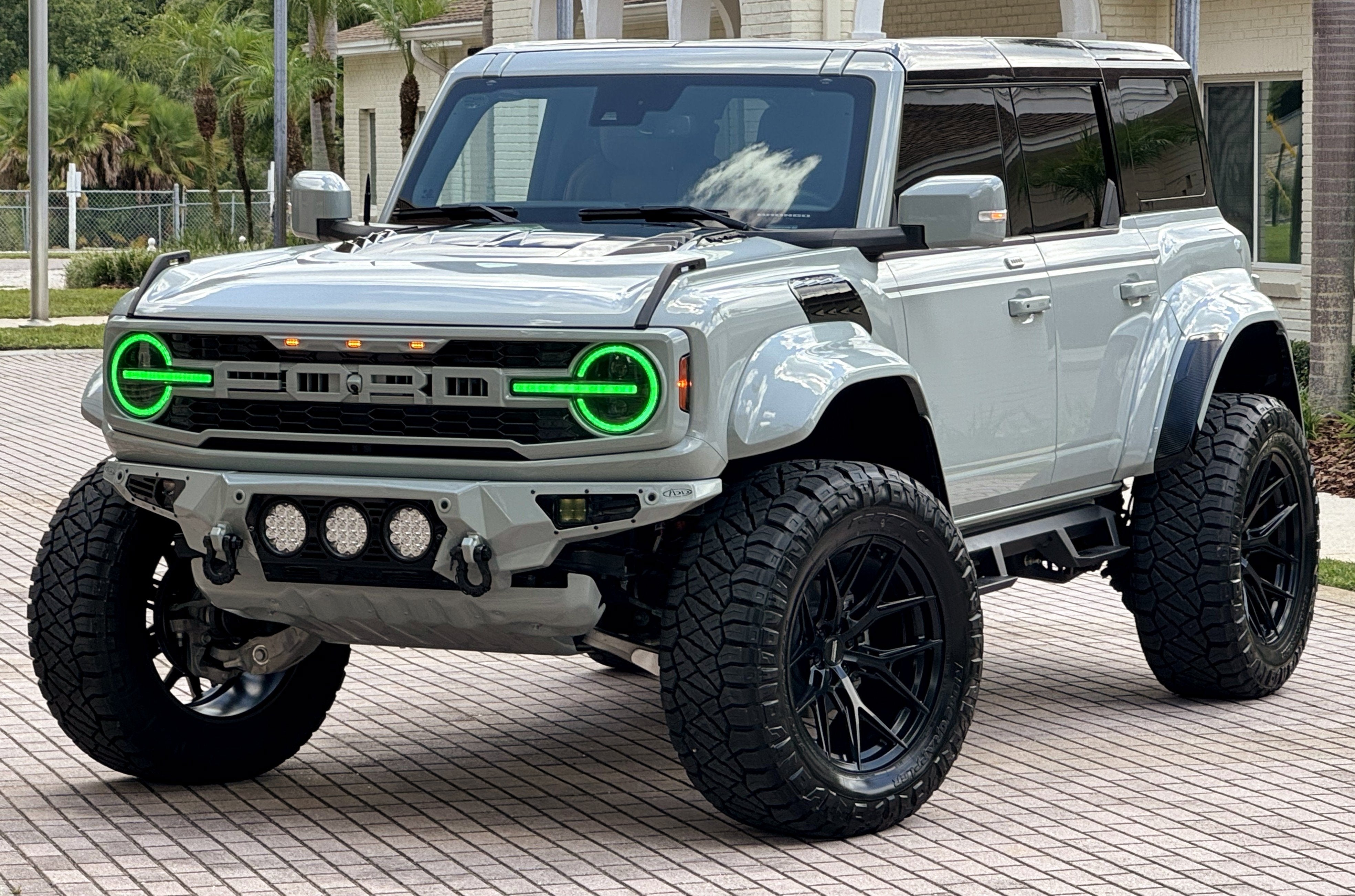 2024 Ford Bronco Raptor Black Appearance Luxury Package Custom Lifted in Cactus Gray — front three-quarter view