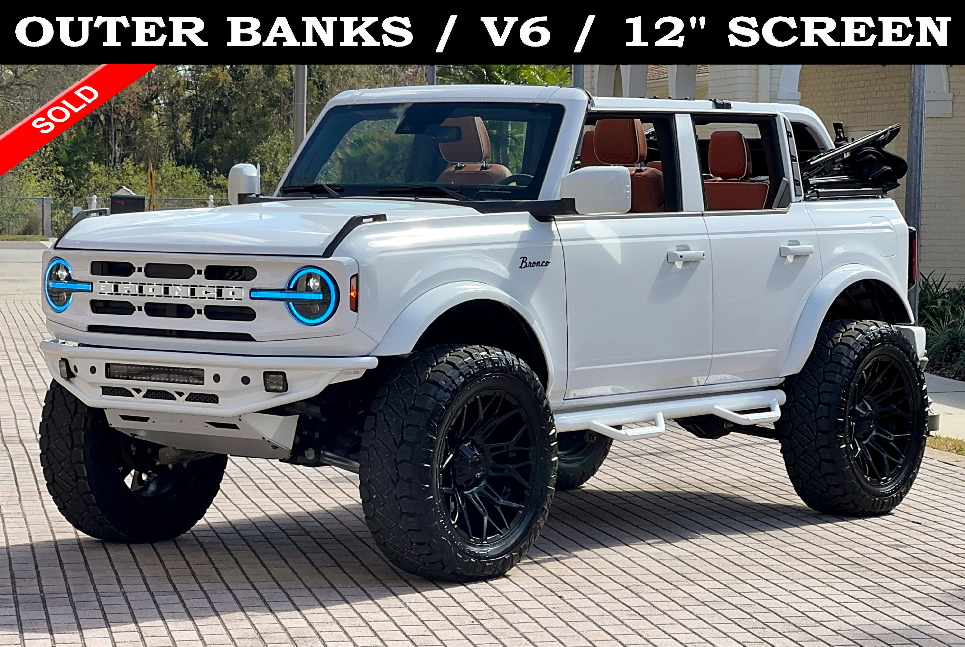 2025 Ford Bronco Outer Banks V6 Custom Lifted in Oxford White — front three-quarter view